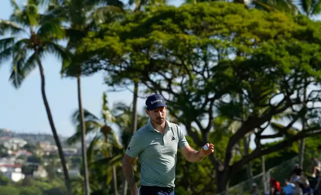 Nick Taylor, of Canada, reacts on the 18tyh hole during the first round of the Sony Open golf event at the Waialae Country Club in Honolulu, Thursday, Jan. 15, 2026. (AP Photo/Matt York)