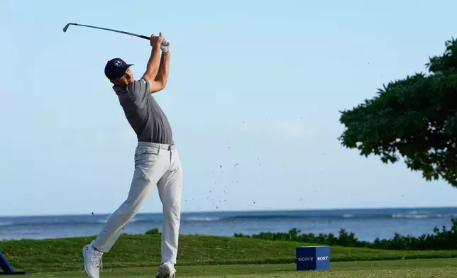 Jordan Spieth hits from the 17th tee during the first round of the Sony Open golf event at the Waialae Country Club in Honolulu, Thursday, Jan. 15, 2026. (AP Photo/Matt York)
