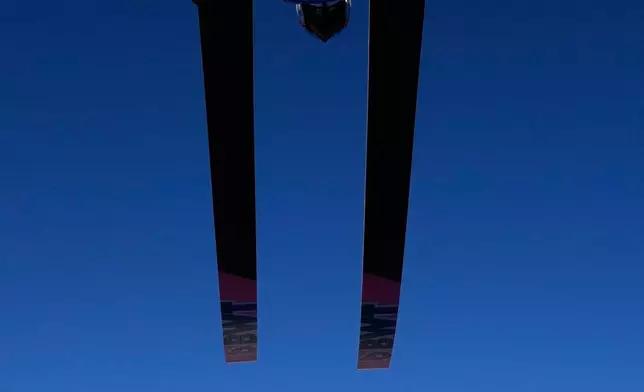 FILE - Poland's Dawid Kubacki soars through the air during his trial jump at the third stage of the Four Hills ski jumping tournament in Innsbruck, Austria, Jan. 4, 2026. (AP Photo/Matthias Schrader, File)