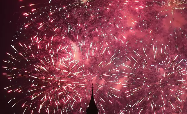 FILE - Fireworks light-up central London for the New Year, Jan. 1, 2026. (AP Photo/Alberto Pezzali, File)