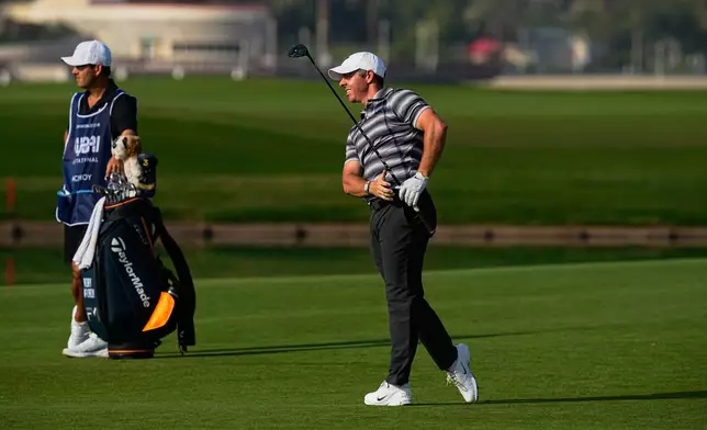 Rory McIlroy of Northern Ireland plays his second shot during the first round of Dubai Invitational golf tournament in Dubai, United Arab Emirates, Thursday, Jan. 15, 2026. (AP Photo/Fatima Shbair)