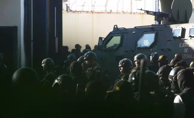Security forces enter the Renovation maximum-security prison to free guards taken hostage and retake control of the facility, which houses gang leaders, in Escuintla, Guatemala, Sunday, Jan. 18, 2026. (AP Photo/Moises Castillo)