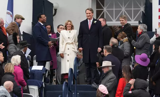 Va. Gov. Glenn Youngkin arrives with his wife before Virginia gov.-elect Abigail Spanberger inauguration at the Capitol in Richmond, Va., Saturday Jan. 17, 2026. (AP Photo/Stephanie Scarbrough)