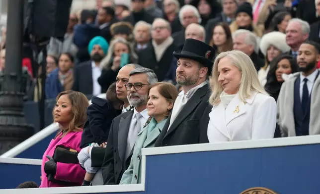 Virginia Gov. Abigail Spanberger sits with her husband Adam Spanberger during inaugural ceremonies at the Capitol in Richmond Va., Saturday Jan. 17, 2026. (AP Photo/Steve Helber, Pool)