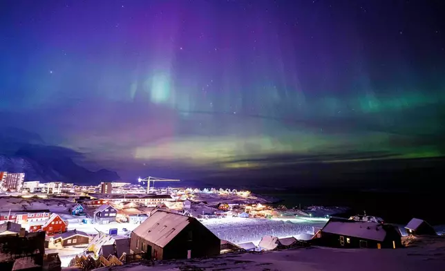 Aurora borealis, also known as the northern lights, is seen in the sky above Nuuk, Greenland, Tuesday, Jan. 20, 2026. (AP Photo/Evgeniy Maloletka)