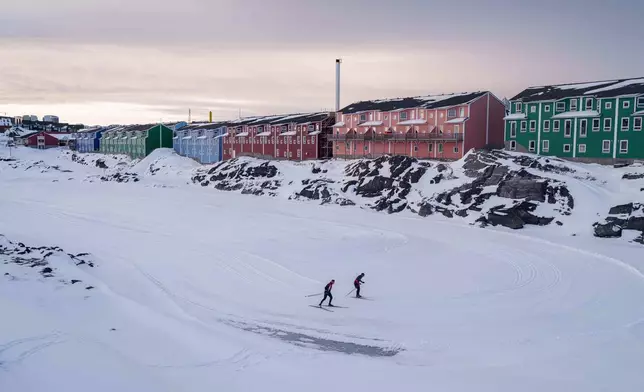 Cross-country skiers train in Nuuk, Greenland, Wednesday, Jan. 14, 2026. (AP Photo/Evgeniy Maloletka)