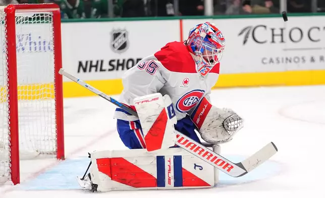 Montréal Canadiens goaltender Samuel Montembeault defends the goal during the first period of an NHL hockey game against the Dallas Stars, Sunday, Jan. 4, 2026, in Dallas. (AP Photo/LM Otero)