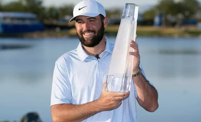 Scottie Scheffler smiles after winning the American Express golf event on the Pete Dye Stadium Course at PGA West Sunday, Jan. 25, 2026, in La Quinta, Calif. (AP Photo/Ross D. Franklin)