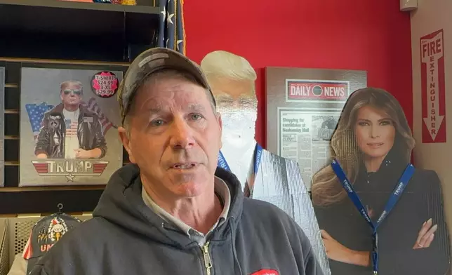 Paul Bonner, 67, talks at the Trump Store in Bensalem Pa., Monday, Jan. 5, 2026, looking for a Trump 2028 sign. Speaking about the U.S. raid that captured Venezuela's president. Bonner said he supports Trump "so far." (AP Photo/ Mike Catalini)