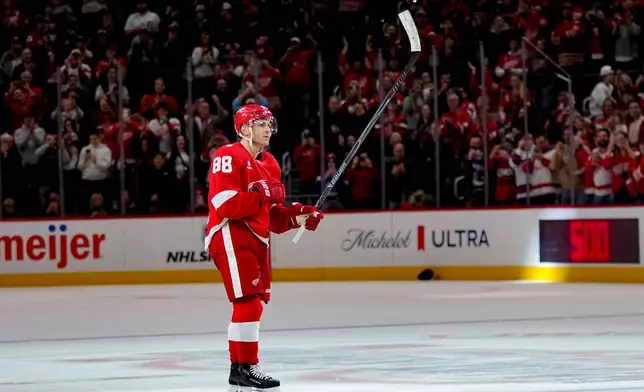 Detroit Red Wings right wing Patrick Kane celebrates after scoring his 500th career goal during the third period of an NHL hockey game against the Vancouver Canucks Thursday, Jan. 8, 2026, in Detroit. (AP Photo/Ryan Sun)