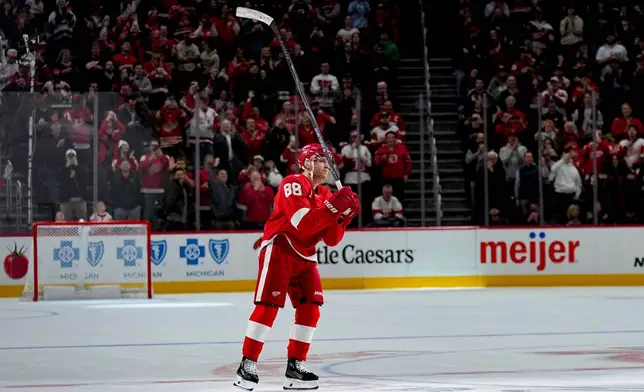 Detroit Red Wings right wing Patrick Kane celebrates after scoring his 500th career goal during the third period of an NHL hockey game against the Vancouver Canucks Thursday, Jan. 8, 2026, in Detroit. (AP Photo/Ryan Sun)