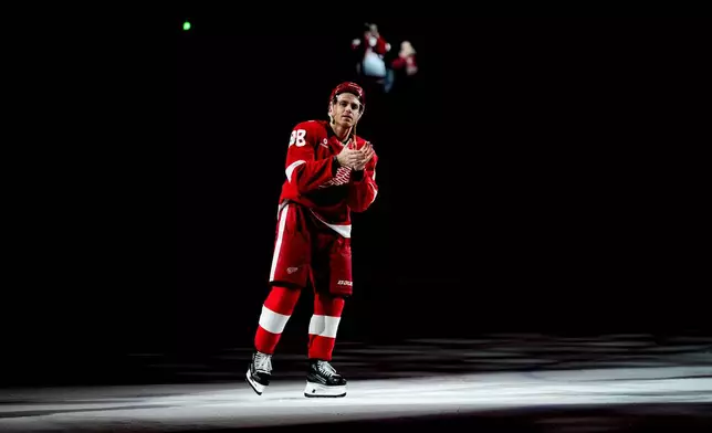 Detroit Red Wings right wing Patrick Kane celebrates after the team's win against the Vancouver Canucks in an NHL hockey game after scoring his 500th career goal Thursday, Jan. 8, 2026, in Detroit. (AP Photo/Ryan Sun)