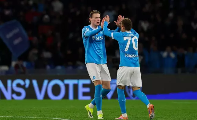 Napoli's Scott McTominay celebrates after scoring their side's first goal of the game during the Serie A soccer match between Napoli and Verona in Naples, Italy, Wednesday, Jan. 7, 2026. (Alessandro Garofalo/LaPresse via AP)
