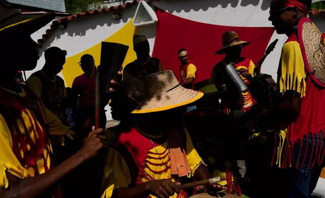 FILE - Revelers take part in the Afro-Venezuelan Holy Innocents' Day celebration in Caucagua, Venezuela, Dec. 28, 2025. (AP Photo/Matias Delacroix, File)