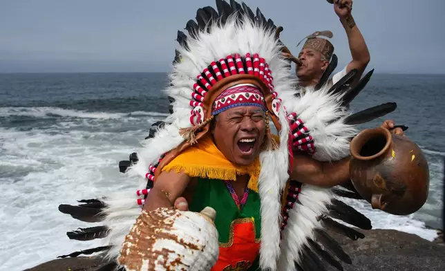 FILE - Shamans perform an annual ritual to predict political and social issues for the new year in Lima, Peru, Dec. 29, 2025. (AP Photo/Guadalupe Pardo, File)