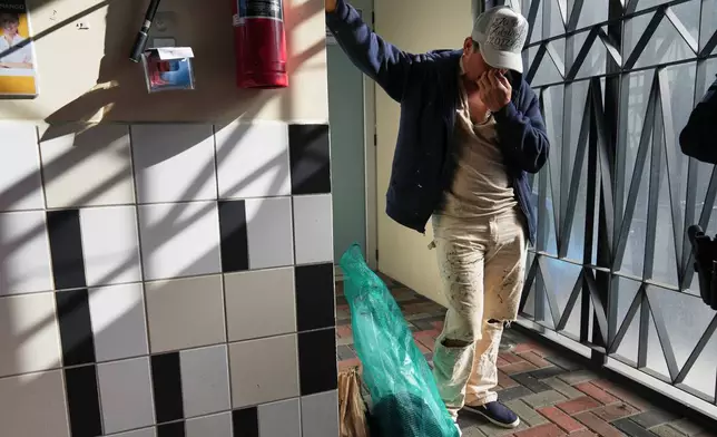 FILE - A Guatemalan deported from the U.S. waits to leave a processing center after returning with other migrants on a repatriation flight to La Aurora airport in Guatemala City, Dec. 30, 2025. The man, who did not want to give his name, said he was detained while on his way to work at a construction site in Georgia. (AP Photo/Moises Castillo, File)