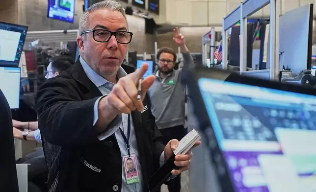 Options trader Joseph D'Arrigo works on the floor of the New York Stock Exchange, Wednesday, Jan. 7, 2026. (AP Photo/Richard Drew)
