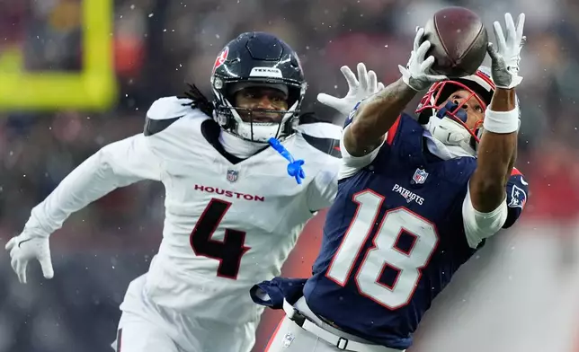New England Patriots wide receiver Kyle Williams (18) cannot catch a pass against Houston Texans cornerback Kamari Lassiter (4) during the first half of an NFL divisional playoff football game, Sunday, Jan. 18, 2026, in Foxborough, Mass. (AP Photo/Robert F. Bukaty)