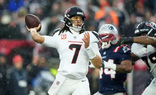 Houston Texans quarterback C.J. Stroud (7) throws a touchdown pass to wide receiver Christian Kirk against the New England Patriots during the first half of an NFL divisional playoff football game, Sunday, Jan. 18, 2026, in Foxborough, Mass. (AP Photo/Robert F. Bukaty)