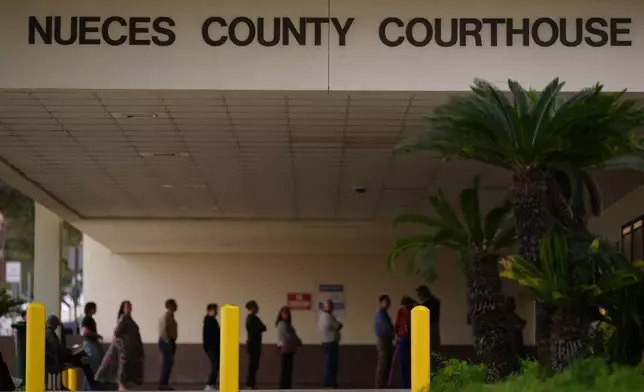 A line forms at the Nueces County Courthouse in Corpus Christi, Texas, as jury selection continues in the trial for former Uvalde school district police officer Adrian Gonzales, Monday, Jan. 5, 2026. (AP Photo/Eric Gay)