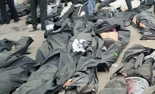 This frame grab from videos taken between Jan. 9 and Jan. 11, 2026, and circulating on social media purportedly shows images from a morgue with dozens of bodies and mourners after crackdown on the outskirts of Iran's capital, in Kahrizak, Tehran Province. (UGC via AP)