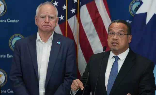 Attorney General Keith Ellison, right, and Minnesota Gov. Tim Walz give a news conference in Blaine, Minn., Sunday, Jan. 25, 2026. (AP Photo/Abbie Parr)