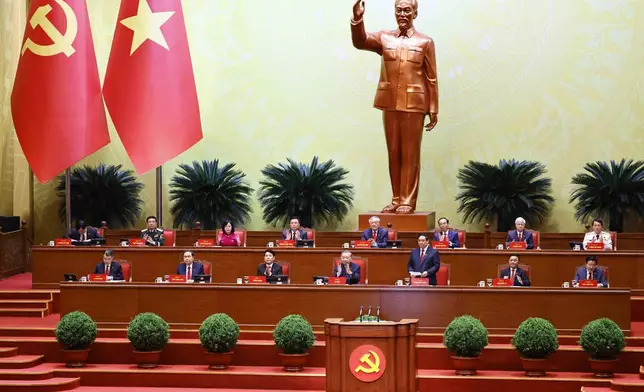 Vietnam's Prime Minister Pham Minh Chinh, third right in front, addresses the National Congress in Hanoi, Vietnam, Tuesday, Jan. 20, 2026. (Bui Cuong Quyet/VNA via AP)
