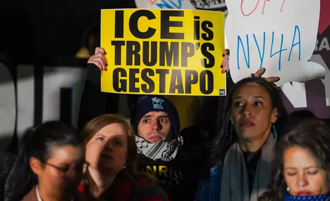 People participate in a protest in response to the fatal shooting of Renee Nicole Good by a Federal immigration officer this morning in Minneapolis, Wednesday, Jan. 7, 2026, in New York. (AP Photo/Ryan Murphy)