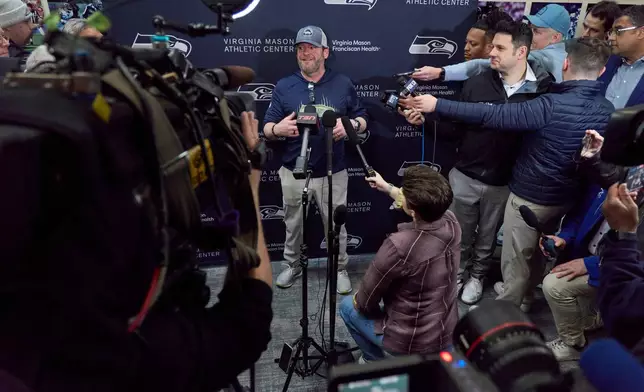 Seattle Seahawks general manager John Schneider, center, speaks during a news conference at the NFL football team's facilities ahead of Super Bowl 60, Thursday, Jan. 29, 2026, in Seattle. (AP Photo/John Froschauer)