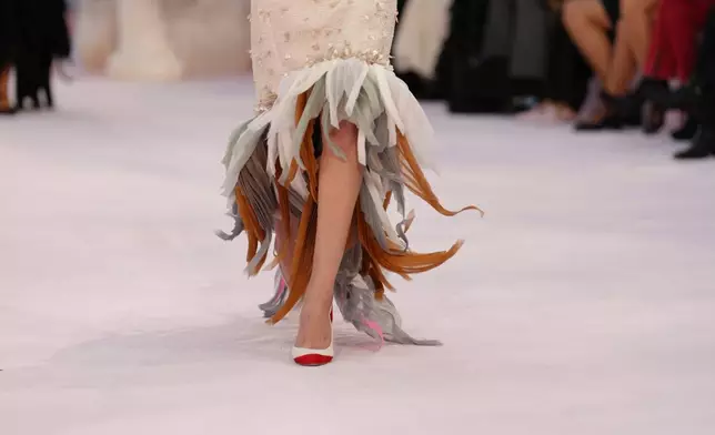 A model wears a creation as part of the Chanel Spring/Summer 2026 Haute Couture collection presented in Paris, Tuesday, Jan. 27, 2026. (AP Photo/Aurelien Morissard)