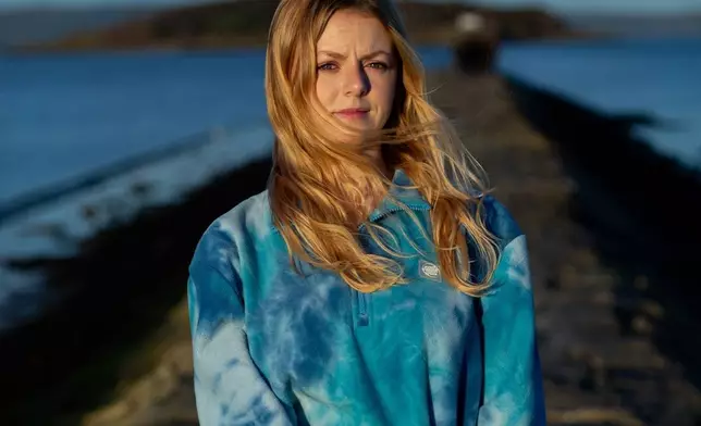 Caitlin Turner, a marine biologist, poses for a portrait on Nov. 17, 2025, in Cramond Village, Scotland. (AP Photo/Emily Whitney)