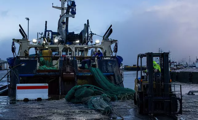 Fisherman work on a boat in the North Sea on Jan. 5, 2026, in Fraserburgh, a fishing town in northeastern Scotland. (AP Photo/Emily Whitney)