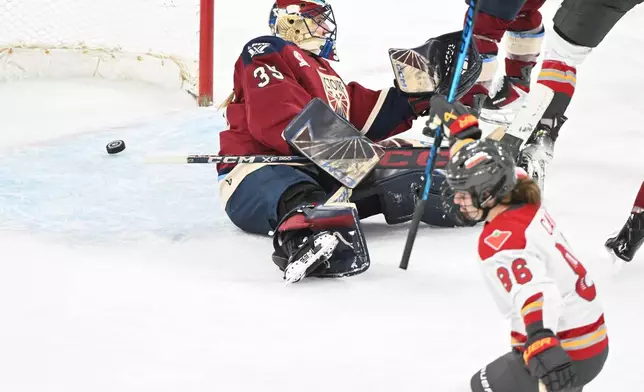 Ottawa Charge's Michela Cava (86) reacts after scoring against Montreal Victoire goaltender Ann-Renee Desbiens (35) during the second period of an PWHL hockey game in Laval, Que., Saturday, Jan. 24, 2026. (Graham Hughes/The Canadian Press via AP)