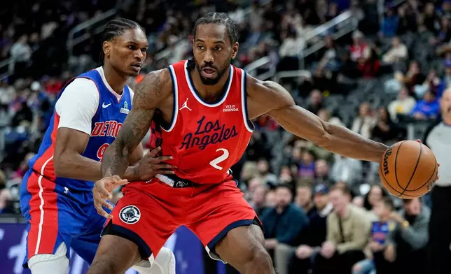Los Angeles Clippers forward Kawhi Leonard, right, drives against Detroit Pistons guard Ausar Thompson, left, during the first half of an NBA basketball game Saturday, Jan. 10, 2026, in Detroit. (AP Photo/Ryan Sun)