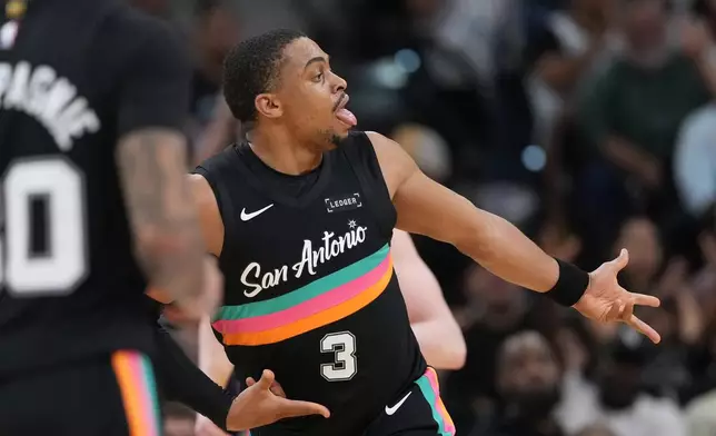 San Antonio Spurs forward Keldon Johnson (3) celebrates a score against the Los Angeles Lakers during the second half of an NBA basketball game in San Antonio, Wednesday, Jan. 7, 2026. (AP Photo/Eric Gay)