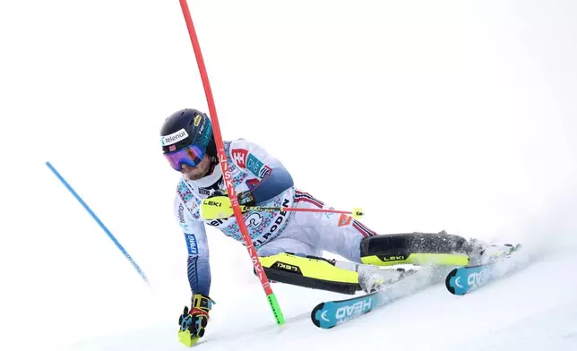 Norway's Atle Lie McGrath speeds down the course during an alpine ski, men's World Cup slalom, in Adelboden, Switzerland, Sunday, Jan. 11, 2026. (AP Photo/Giovanni Zenoni)