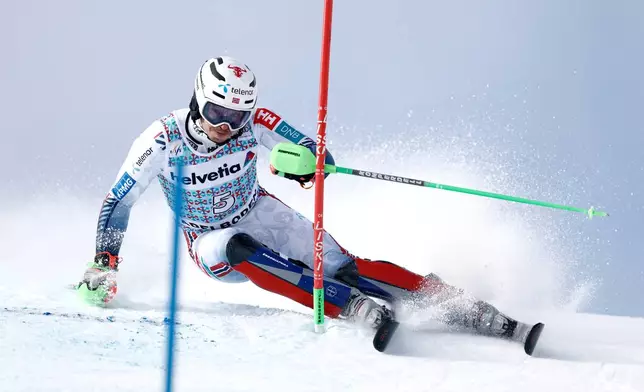 Norway's Henrik Kristoffersen speeds down the course during an alpine ski, men's World Cup slalom, in Adelboden, Switzerland, Sunday, Jan. 11, 2026. (AP Photo/Gabriele Facciotti)