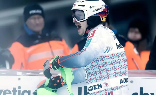 Norway's Henrik Kristoffersen reacts at the finish line during an alpine ski, men's World Cup slalom, in Adelboden, Switzerland, Sunday, Jan. 11, 2026. (AP Photo/Gabriele Facciotti)