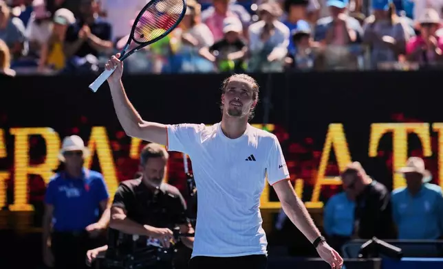 Alexander Zverev of Germany waves after defeating Gabriel Diallo of Canada in their first round match at the Australian Open tennis championship in Melbourne, Australia, Sunday, Jan. 18, 2026. (AP Photo/Dita Alangkara)