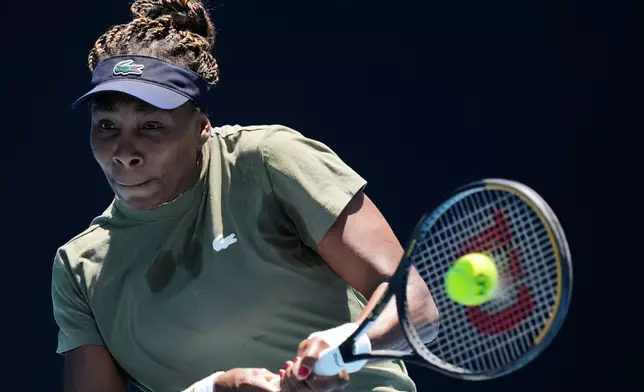 Venus Williams of the United States plays a backhand return during a practice session ahead of the Australian Open tennis championship in Melbourne, Australia, Saturday, Jan. 17, 2026. (AP Photo/Aaron Favila)