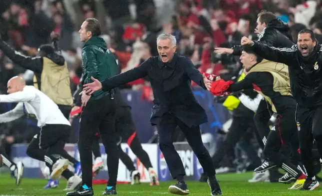 Benfica's head coach Jose Mourinho runs celebrating at the end of a Champions League opening phase soccer match between Benfica and Real Madrid, in Lisbon, Wednesday, Jan. 28, 2026. (AP Photo/Armando Franca)