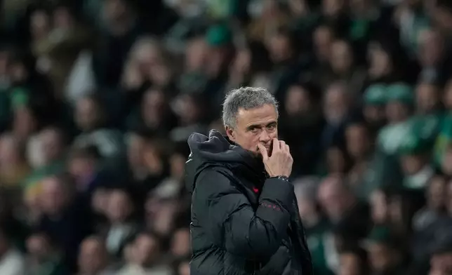 PSG's head coach Luis Enrique reacts during the Champions League opening phase soccer match between Sporting CP and Paris Saint-Germain, in Lisbon, Tuesday, Jan. 20, 2026. (AP Photo/Armando Franca)
