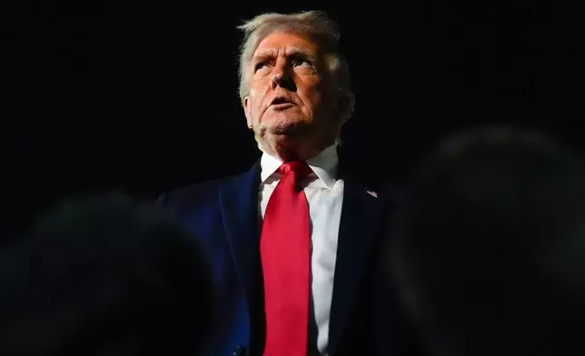President Donald Trump speaks with reporters after arriving at Palm Beach International Airport, Monday, Jan. 19, 2026, in West Palm Beach, Fla. (AP Photo/Julia Demaree Nikhinson)