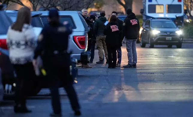 Law enforcement officials work the scene following reports that federal immigration officers shot and wounded people in Portland, Ore., Thursday, Jan. 8, 2026. (AP Photo/Jenny Kane)