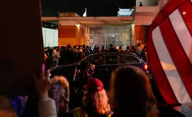 Protesters and law enforcement stand outside the U.S. Immigration and Customs Enforcement facility on Thursday, Jan. 8, 2026, in Portland, Ore. (AP Photo/Jenny Kane)