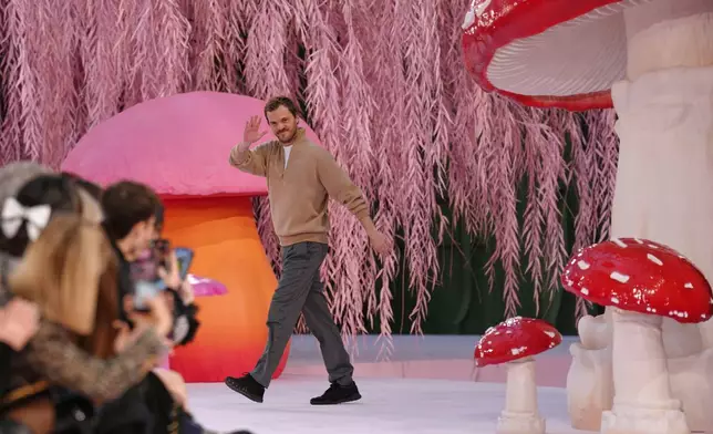 Designer Matthieu Blazy accepts applause after the Chanel Spring/Summer 2026 Haute Couture collection presented in Paris, Tuesday, Jan. 27, 2026. (AP Photo/Aurelien Morissard)