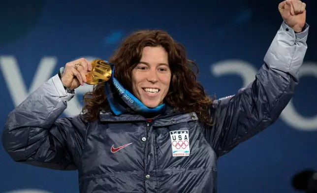 FILE - USA's gold medalist Shaun White reacts during the men's halfpipe medal ceremony at the Vancouver 2010 Olympics in Vancouver, British Columbia, Thursday, Feb. 18, 2010. (AP Photo/Jae C. Hong, File)