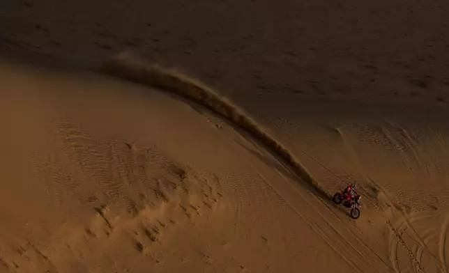 Rider Luciano Benavides competes during the twelfth stage of the Dakar Rally between Al Henakiyah and Yanbu, Saudi Arabia, Friday, Jan.16, 2026. (AP Photo/Thibault Camus)