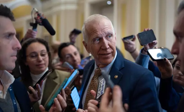 Sen. Thom Tillis, R-N.C., speaks with reporters following a closed-door meeting with fellow Republicans on spending legislation that funds the Department of Homeland Security and a swath of other government agencies, at the Capitol in Washington, Wednesday, Jan. 28, 2026. (AP Photo/J. Scott Applewhite)