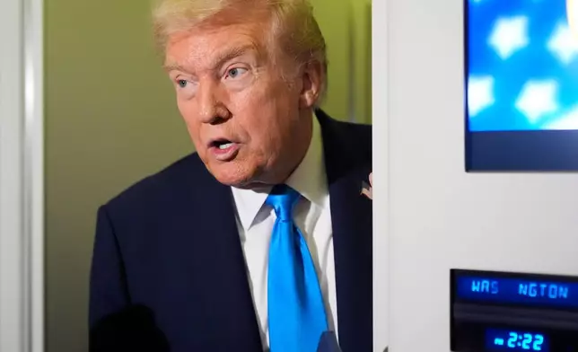 FILE - President Donald Trump speaks with reporters aboard Air Force One at Al Udeid Air Base in Doha, Qatar, Oct. 25, 2025. (AP Photo/Mark Schiefelbein, File)